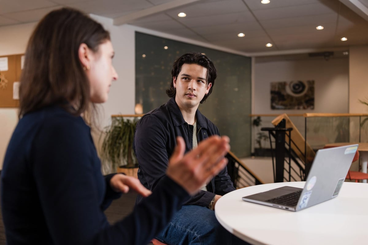Two people deep in discussion at a table.